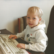 Young Cam playing on a computer